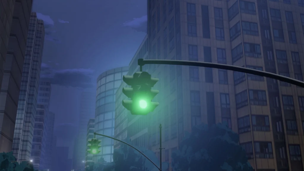 Grüne Ampeln in einer nächtlichen Stadt mit modernen Hochhäusern.